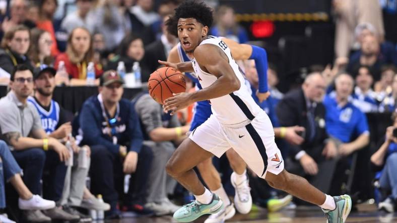 Mar 11, 2023; Greensboro, NC, USA;  Virginia Cavaliers guard Reece Beekman (2) dribbles in the second half of the Championship game of the ACC Tournament at Greensboro Coliseum. Mandatory Credit: Bob Donnan-USA TODAY Sports