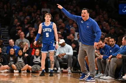 Mar 11, 2023; New York, NY, USA; Xavier Musketeers head coach Sean Miller yells instructions to players while Xavier Musketeers guard Adam Kunkel (5) looks on during the second half at Madison Square Garden. Mandatory Credit: Mark Smith-USA TODAY Sports
