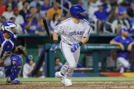 Mar 12, 2023; Miami, Florida, USA; Israel designated hitter Spencer Horwitz (4) hits an RBI single during the eighth inning against Nicaragua at LoanDepot Park. Mandatory Credit: Sam Navarro-USA TODAY Sports