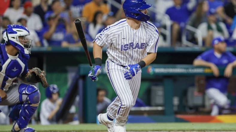 Mar 12, 2023; Miami, Florida, USA; Israel designated hitter Spencer Horwitz (4) hits an RBI single during the eighth inning against Nicaragua at LoanDepot Park. Mandatory Credit: Sam Navarro-USA TODAY Sports