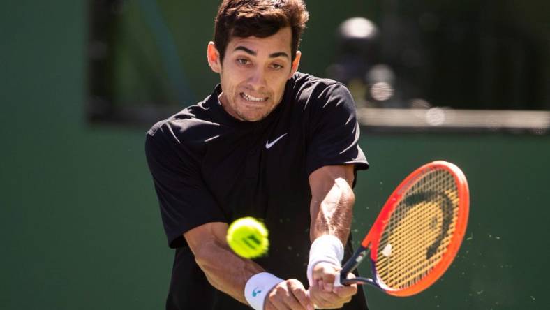 Cristian Garin of Chile hits to Casper Ruud of Norway during their round three match at the BNP Paribas Open at the Indian Wells Tennis Garden in Indian Wells, Calif., Sunday, March 12, 2023.