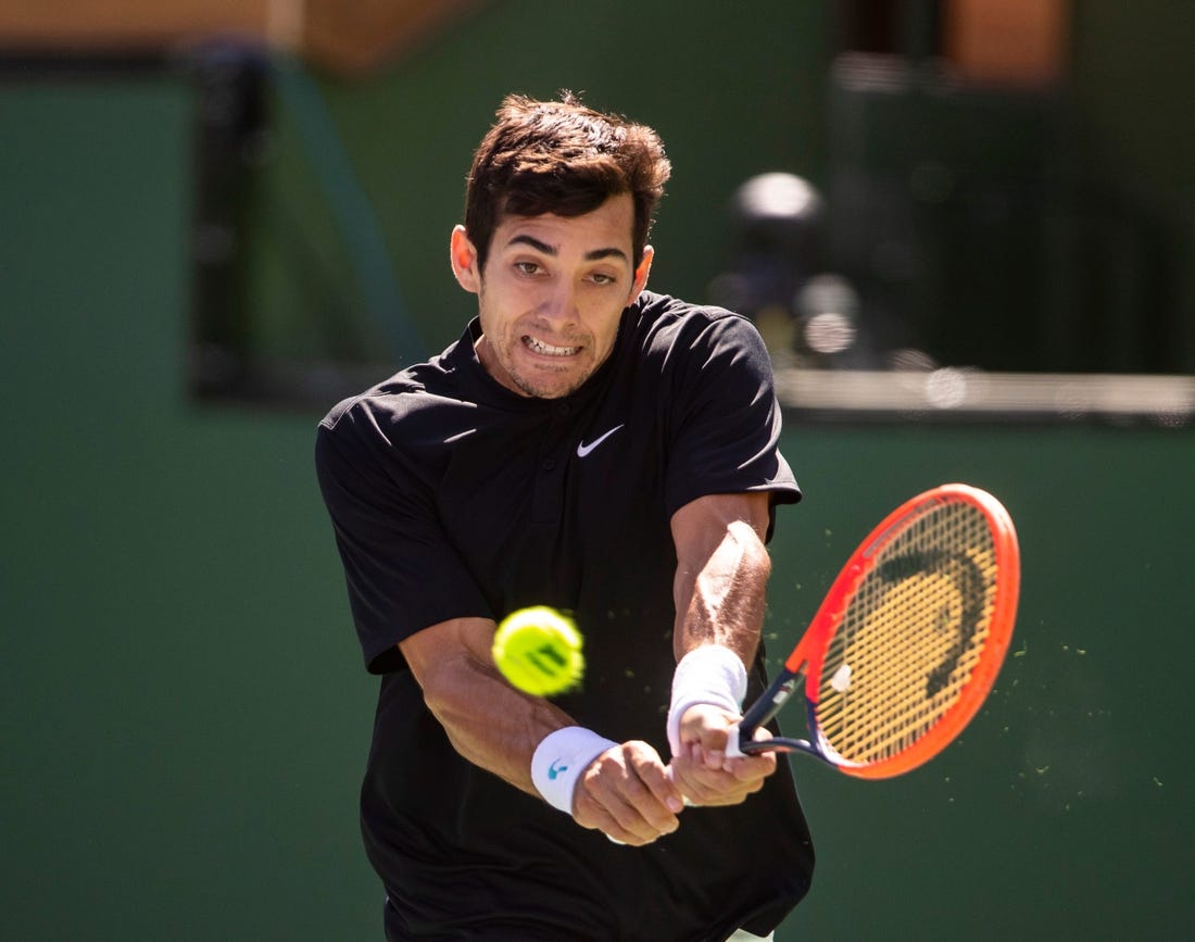 Cristian Garin of Chile hits to Casper Ruud of Norway during their round three match at the BNP Paribas Open at the Indian Wells Tennis Garden in Indian Wells, Calif., Sunday, March 12, 2023.