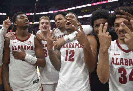 Mar 12, 2023; Nashville, TN, USA;  Alabama Crimson Tide guard Jaden Bradley (0), center Charles Bediako (14), guard Jahvon Quinerly (5), guard Adam Cottrell (30), guard Delaney Heard (12), and guard Rylan Griffen (3) celebrate the win against the Texas A&M Aggies during the second half at Bridgestone Arena. Mandatory Credit: Steve Roberts-USA TODAY Sports