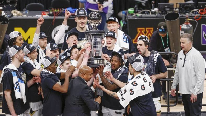 Mar 12, 2023; Chicago, IL, USA; Purdue Boilermakers players celebrate after winning Big Ten Conference Tournament Championship against the Penn State Nittany Lions at United Center. Mandatory Credit: Kamil Krzaczynski-USA TODAY Sports