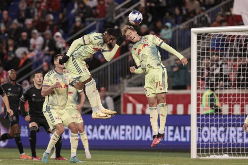 Mar 4, 2023; Harrison, New Jersey, USA; New York Red Bulls forward Tom Barlow (74) heads the ball in front of defender Andres Reyes (4) during the first half against the Nashville SC at Red Bull Arena. Mandatory Credit: Vincent Carchietta-USA TODAY Sports