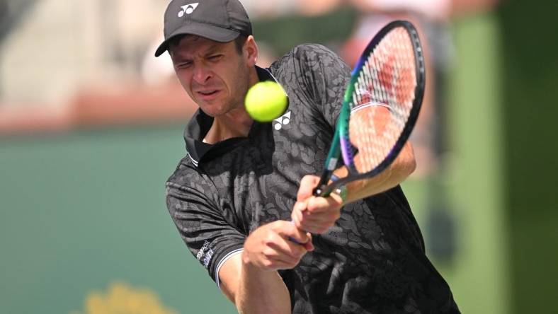 Mar 13, 2023; Indian Wells, CA, USA;  Hubert Hurkacz (POL) hits a shot in his fourth round match against Tommy Paul (USA) during the BNP Paribas Open at the Indian Wells Tennis Garden. Mandatory Credit: Jayne Kamin-Oncea-USA TODAY Sports