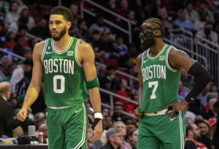 Mar 13, 2023; Houston, Texas, USA;  Boston Celtics forward Jayson Tatum (0) and  guard Jaylen Brown (7) talk to each other during a Houston Rockets timeout in the second quarter at Toyota Center. Mandatory Credit: Thomas Shea-USA TODAY Sports