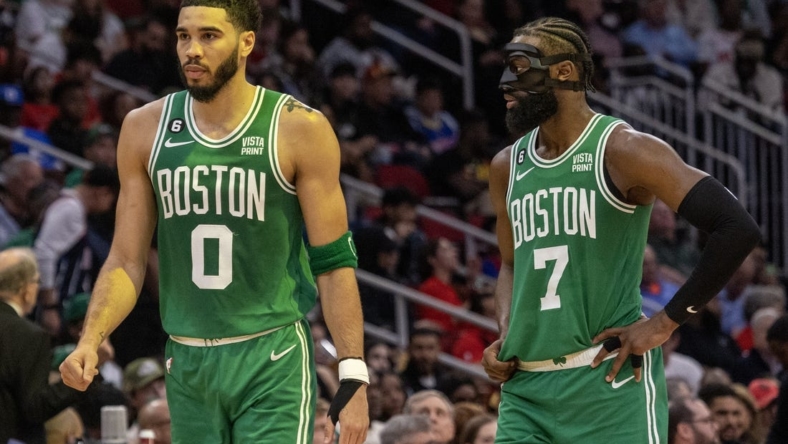 Mar 13, 2023; Houston, Texas, USA;  Boston Celtics forward Jayson Tatum (0) and  guard Jaylen Brown (7) talk to each other during a Houston Rockets timeout in the second quarter at Toyota Center. Mandatory Credit: Thomas Shea-USA TODAY Sports