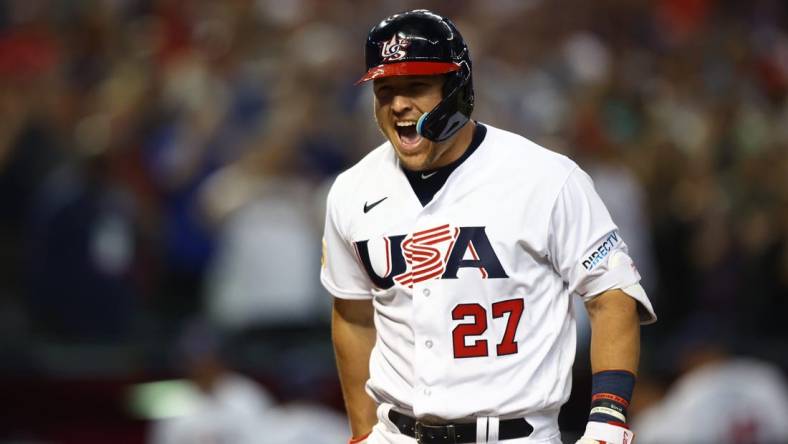 Mar 13, 2023; Phoenix, Arizona, USA; USA outfielder Mike Trout celebrates after hitting a three run home run in the first inning against Canada during the World Baseball Classic at Chase Field. Mandatory Credit: Mark J. Rebilas-USA TODAY Sports