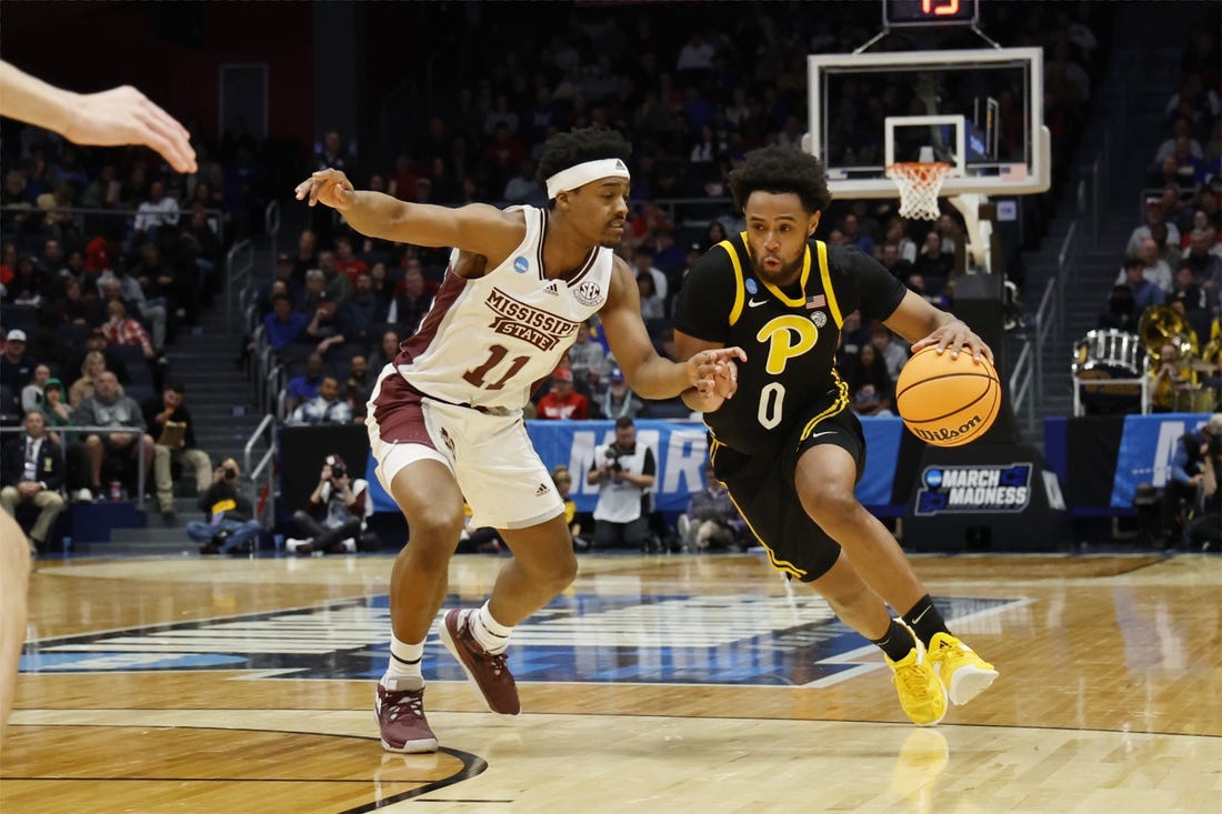 Mar 14, 2023; Dayton, OH, USA; Pittsburgh Panthers guard Nelly Cummings (0) moves the ball defended by Mississippi State Bulldogs guard Eric Reed Jr. (11) in the first half at UD Arena. Mandatory Credit: Rick Osentoski-USA TODAY Sports