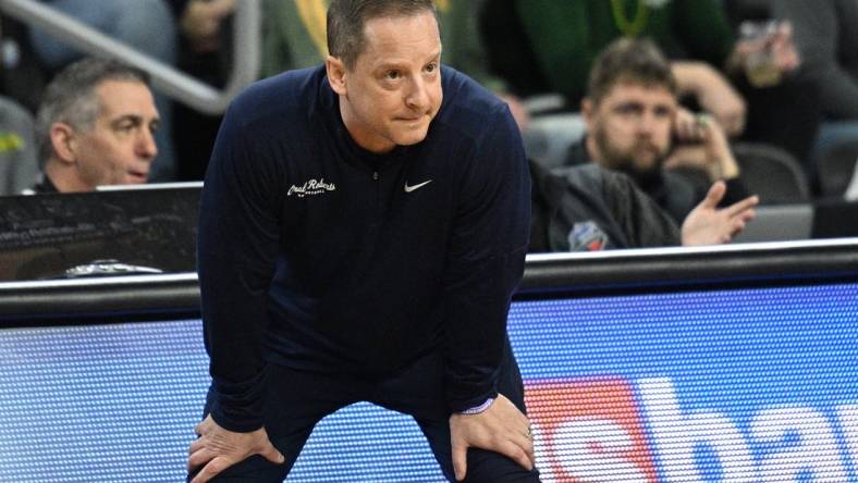 Mar 7, 2023; Sioux Falls, SD, USA;  Oral Roberts Golden Eagles head coach Paul Mills watches action against the North Dakota State Bison in the first half at Denny Sanford Premier Center. Mandatory Credit: Steven Branscombe-USA TODAY Sports