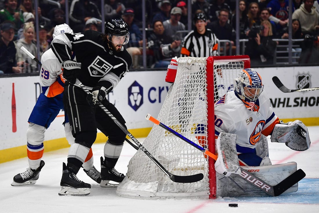 Mar 14, 2023; Los Angeles, California, USA; Los Angeles Kings center Phillip Danault (24) moves in for a shot against New York Islanders goaltender Ilya Sorokin (30) during the second period at Crypto.com Arena. Mandatory Credit: Gary A. Vasquez-USA TODAY Sports