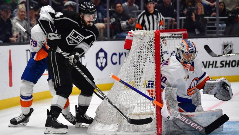 Mar 14, 2023; Los Angeles, California, USA; Los Angeles Kings center Phillip Danault (24) moves in for a shot against New York Islanders goaltender Ilya Sorokin (30) during the second period at Crypto.com Arena. Mandatory Credit: Gary A. Vasquez-USA TODAY Sports