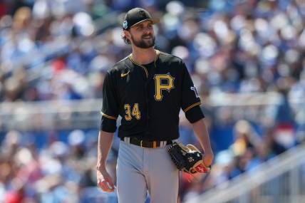 Mar 15, 2023; Dunedin, Florida, USA;  Pittsburgh Pirates starting pitcher JT Brubaker (34) looks on after a stop in play against the Toronto Blue Jays in the third inning during spring training at TD Ballpark. Mandatory Credit: Nathan Ray Seebeck-USA TODAY Sports