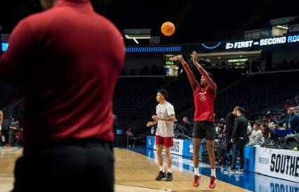 Alabama Crimson Tide player Brandon Miller (24) takes a jump shot as additional security watches on from the baseline during practice before the first round of NCAA Tournament at Legacy Arena in Birmingham, Ala., on Wednesday, March 15, 2023.