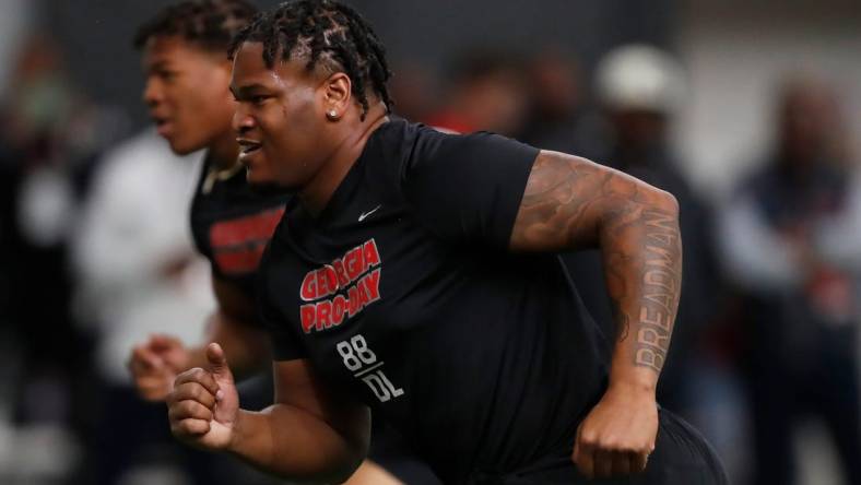 Georgia defensive lineman Jalen Carter (88) and Georgia linebacker Nolan Smith (4) run a drill during UGA Pro Day in Athens, Ga., on Wednesday, March 15, 2023.

News Joshua L Jones