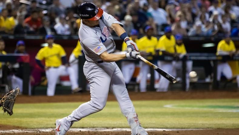 Mar 15, 2023; Phoenix, Arizona, USA; USA outfielder Mike Trout hits a two run single in the fifth inning against Colombia during the World Baseball Classic at Chase Field. Mandatory Credit: Mark J. Rebilas-USA TODAY Sports