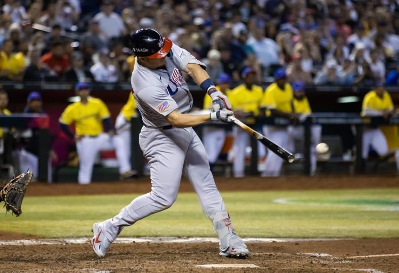 Mar 15, 2023; Phoenix, Arizona, USA; USA outfielder Mike Trout hits a two run single in the fifth inning against Colombia during the World Baseball Classic at Chase Field. Mandatory Credit: Mark J. Rebilas-USA TODAY Sports