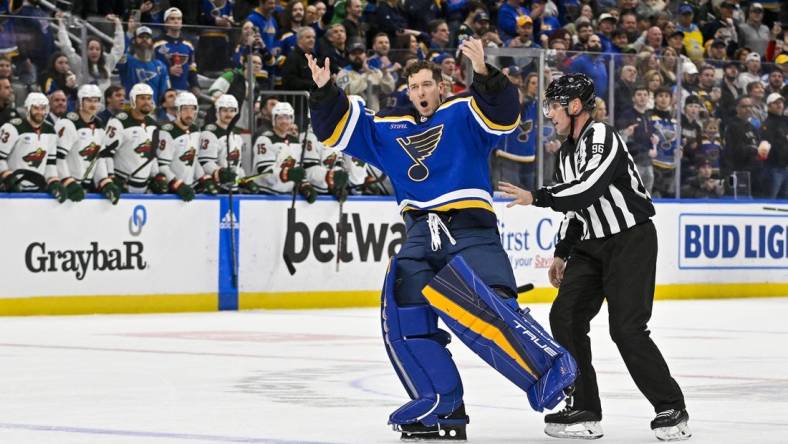 Mar 15, 2023; St. Louis, Missouri, USA;  St. Louis Blues goaltender Jordan Binnington (50) hypes up the crowd after he was ejected from the game during the second period against the Minnesota Wild at Enterprise Center. Mandatory Credit: Jeff Curry-USA TODAY Sports