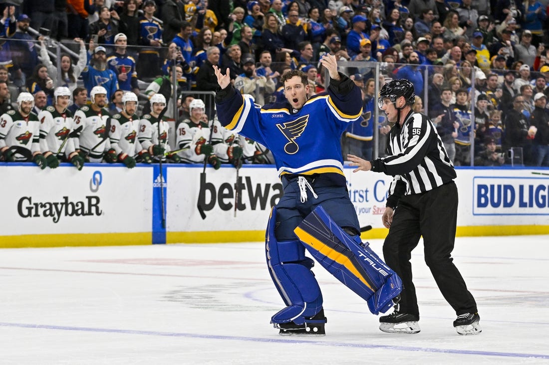 Mar 15, 2023; St. Louis, Missouri, USA;  St. Louis Blues goaltender Jordan Binnington (50) hypes up the crowd after he was ejected from the game during the second period against the Minnesota Wild at Enterprise Center. Mandatory Credit: Jeff Curry-USA TODAY Sports
