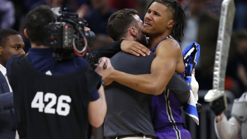 Mar 16, 2023; Orlando, FL, USA; Furman Paladins guard Mike Bothwell (3) celebrates after defeating the Virginia Cavaliers at Amway Center. Mandatory Credit: Russell Lansford-USA TODAY Sports