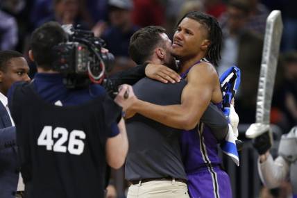 Mar 16, 2023; Orlando, FL, USA; Furman Paladins guard Mike Bothwell (3) celebrates after defeating the Virginia Cavaliers at Amway Center. Mandatory Credit: Russell Lansford-USA TODAY Sports