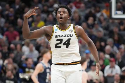 Mar 16, 2023; Sacramento, CA, USA; Missouri Tigers guard Kobe Brown (24) reacts after scoring a basket agianst the Utah State Aggies during the second half at Golden 1 Center. Mandatory Credit: Kyle Terada-USA TODAY Sports