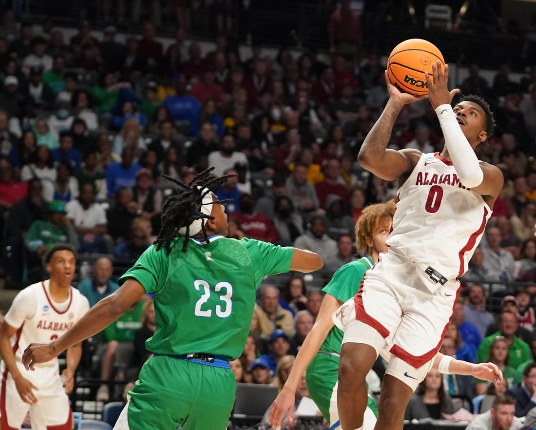 Mar 16, 2023; Birmingham, AL, USA; Alabama Crimson Tide guard Jaden Bradley (0) shoots over Texas A&M-CC Islanders guard Ross Williams (23) during the first half in the first round of the 2023 NCAA Tournament at Legacy Arena. Mandatory Credit: Marvin Gentry-USA TODAY Sports