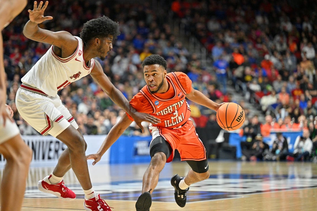 Mar 16, 2023; Des Moines, IA, USA; Illinois Fighting Illini guard Jayden Epps (3) dribbles the ball against Arkansas Razorbacks forward Makhi Mitchell (15) during the first half at Wells Fargo Arena. Mandatory Credit: Jeffrey Becker-USA TODAY Sports