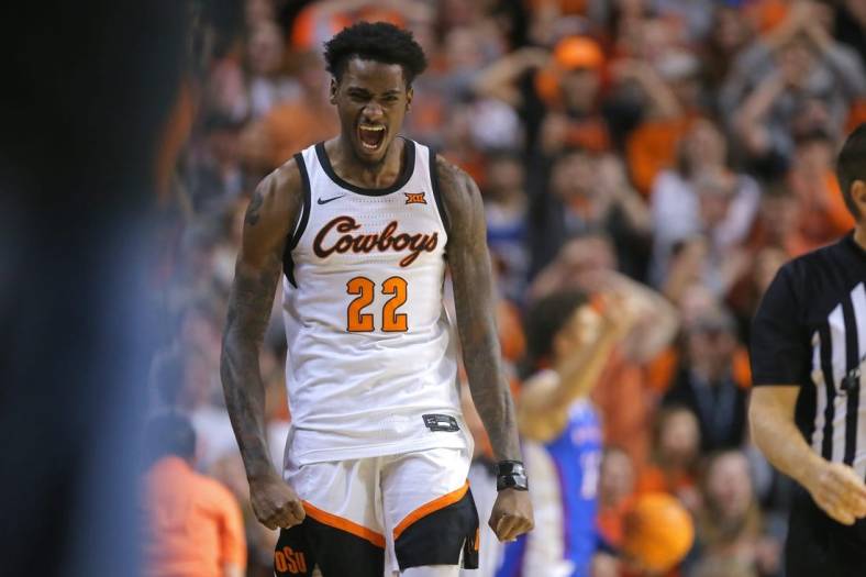 Oklahoma State Cowboys forward Kalib Boone (22) celebrates during a men's college basketball game between the Oklahoma State University Cowboys and the Kansas Jayhawks at Gallagher-Iba Arena in Stillwater, Okla., Wednesday, Feb. 15, 2023.

osu mbb