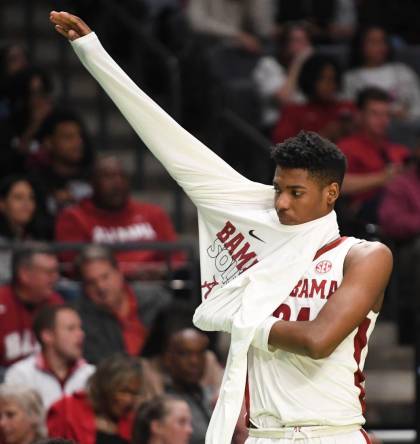 Mar 16, 2023; Birmingham, AL, USA;  Alabama forward Brandon Miller (24), who was held scoreless, puts on a warmup after coming to the bench in the second half at Legacy Arena. Alabama advanced to the second round of the NCAA Tournament with a 96-75 win over Texas A&M Corpus Christi. Mandatory Credit: Gary Cosby Jr.-Tuscaloosa News

Ncaa Basketball Ncaa Tournament Alabama Vs Texas A M Corpus Christi