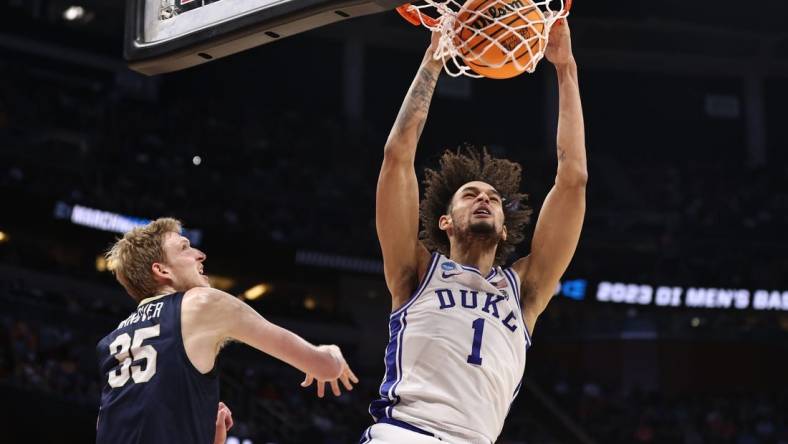 Mar 16, 2023; Orlando, FL, USA; Duke Blue Devils center Dereck Lively II (1) dunks the ball against Oral Roberts Golden Eagles forward Connor Vanover (35) during the first half at Amway Center. Mandatory Credit: Matt Pendleton-USA TODAY Sports