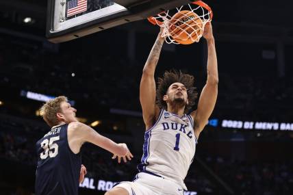 Mar 16, 2023; Orlando, FL, USA; Duke Blue Devils center Dereck Lively II (1) dunks the ball against Oral Roberts Golden Eagles forward Connor Vanover (35) during the first half at Amway Center. Mandatory Credit: Matt Pendleton-USA TODAY Sports
