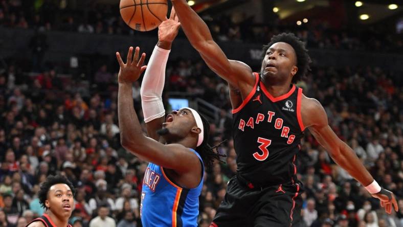 Mar 16, 2023; Toronto, Ontario, CAN; Toronto Raptors forward OG Anunoby (3) blocks a shot from Oklahoma City Thunder guard Luguentz Dort (5) in the first half at Scotiabank Arena. Mandatory Credit: Dan Hamilton-USA TODAY Sports