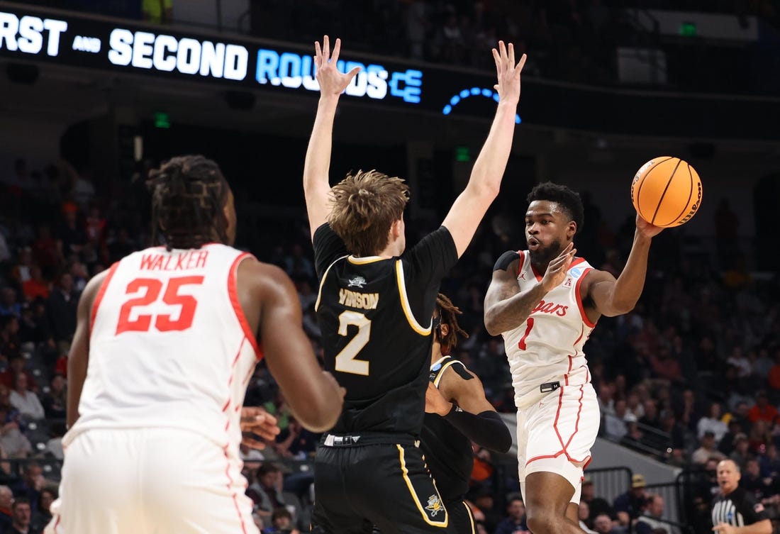 Mar 16, 2023; Birmingham, AL, USA; Houston Cougars guard Jamal Shead (1) passes the ball around Northern Kentucky Norse guard Sam Vinson (2) during the first half in the first round of the 2023 NCAA Tournament at Legacy Arena. Mandatory Credit: Vasha Hunt-USA TODAY Sports