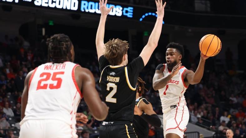 Mar 16, 2023; Birmingham, AL, USA; Houston Cougars guard Jamal Shead (1) passes the ball around Northern Kentucky Norse guard Sam Vinson (2) during the first half in the first round of the 2023 NCAA Tournament at Legacy Arena. Mandatory Credit: Vasha Hunt-USA TODAY Sports