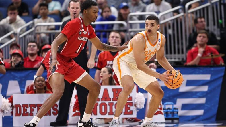 Mar 16, 2023; Orlando, FL, USA; Tennessee Volunteers guard Tyreke Key (4) controls the ball while defended by Louisiana Ragin Cajuns forward Joe Charles (1) during the first half at Amway Center. Mandatory Credit: Matt Pendleton-USA TODAY Sports