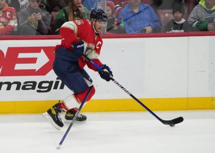 Mar 16, 2023; Sunrise, Florida, USA; Florida Panthers center Aleksander Barkov (16) skates up the ice while  tangled up with a stick in the second period during the game against the Montreal Canadiens at FLA Live Arena. Mandatory Credit: Jim Rassol-USA TODAY Sports