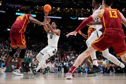 Mar 17, 2023; Columbus, Ohio, USA;  Michigan State Spartans guard A.J. Hoggard (11) lobs a pass over USC Trojans forward Joshua Morgan (24) during the first round of the NCAA men   s basketball tournament at Nationwide Arena. Mandatory Credit: Adam Cairns-The Columbus Dispatch

Basketball Ncaa Men S Basketball Tournament