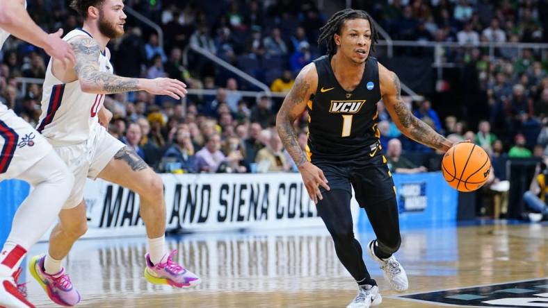 Mar 17, 2023; Albany, NY, USA; Virginia Commonwealth Rams guard Adrian Baldwin Jr. (1) dribbles the ball against the St. Mary's Gaels during the first half at MVP Arena. Mandatory Credit: Gregory Fisher-USA TODAY Sports