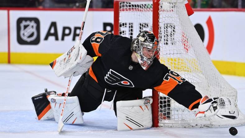 Mar 17, 2023; Philadelphia, Pennsylvania, USA; Philadelphia Flyers goalie Carter Hart (79) reaches for the puck against the Buffalo Sabres in the second period at Wells Fargo Center. Mandatory Credit: Kyle Ross-USA TODAY Sports