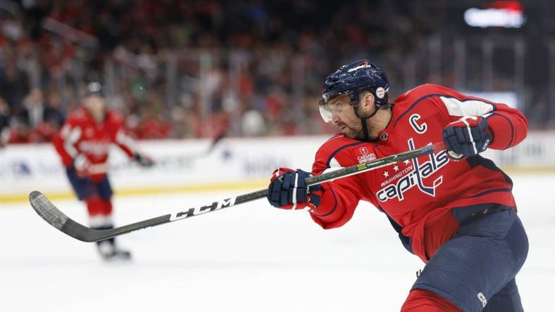 Mar 17, 2023; Washington, District of Columbia, USA; Washington Capitals left wing Alex Ovechkin (8) shoots the puck against the St. Louis Blues in the third period at Capital One Arena. Mandatory Credit: Geoff Burke-USA TODAY Sports