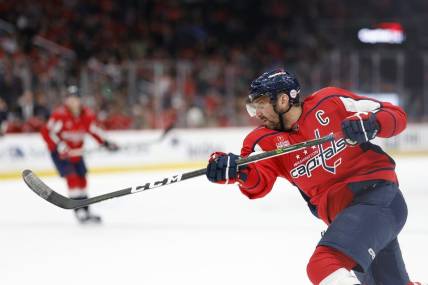 Mar 17, 2023; Washington, District of Columbia, USA; Washington Capitals left wing Alex Ovechkin (8) shoots the puck against the St. Louis Blues in the third period at Capital One Arena. Mandatory Credit: Geoff Burke-USA TODAY Sports