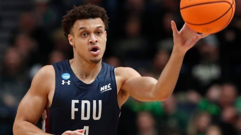 Fairleigh Dickinson Knights guard Grant Singleton (4) passes the ball during the NCAA Men  s Basketball Tournament game against the Purdue Boilermakers, Friday, March 17, 2023, at Nationwide Arena in Columbus, Ohio. Fairleigh Dickinson Knights won 63-58.

Purduefairleigh031723 Am157