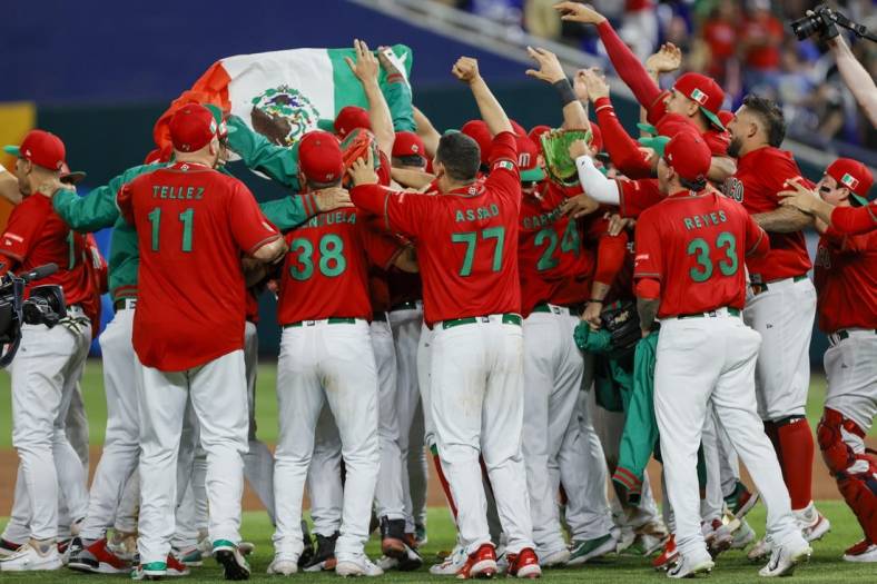 Mar 17, 2023; Miami, Florida, USA; Mexico players celebrate after winning the game against Puerto Rico at LoanDepot Park. Mandatory Credit: Sam Navarro-USA TODAY Sports