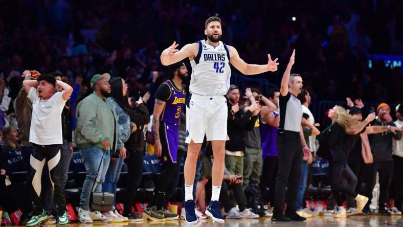 Mar 17, 2023; Los Angeles, California, USA; Dallas Mavericks forward Maxi Kleber (42) reacts after scoring a three point basket against Los Angeles Lakers forward Anthony Davis (3) for the game victory during the second half at Crypto.com Arena. Mandatory Credit: Gary A. Vasquez-USA TODAY Sports