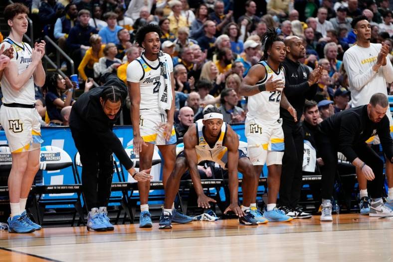 Mar 17, 2023; Columbus, Ohio, USA;  Marquette Golden Eagles players react during the first round of the NCAA men   s basketball tournament against the Vermont Catamounts at Nationwide Arena. Marquette won 78-61. Mandatory Credit: Adam Cairns-The Columbus Dispatch

Basketball Ncaa Men S Basketball Tournament