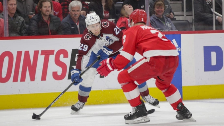 Mar 18, 2023; Detroit, Michigan, USA; Colorado Avalanche center Nathan MacKinnon (29) handles the puck during the first period at Little Caesars Arena. Mandatory Credit: Brian Bradshaw Sevald-USA TODAY Sports