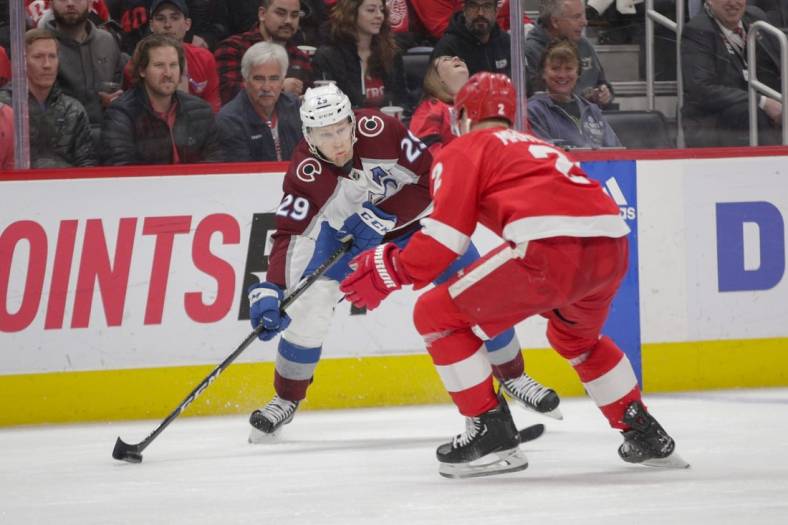 Mar 18, 2023; Detroit, Michigan, USA; Colorado Avalanche center Nathan MacKinnon (29) handles the puck during the first period at Little Caesars Arena. Mandatory Credit: Brian Bradshaw Sevald-USA TODAY Sports
