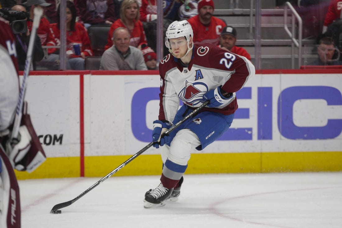 Mar 18, 2023; Detroit, Michigan, USA; Colorado Avalanche center Nathan MacKinnon (29) handles the puck during the second period at Little Caesars Arena. Mandatory Credit: Brian Bradshaw Sevald-USA TODAY Sports